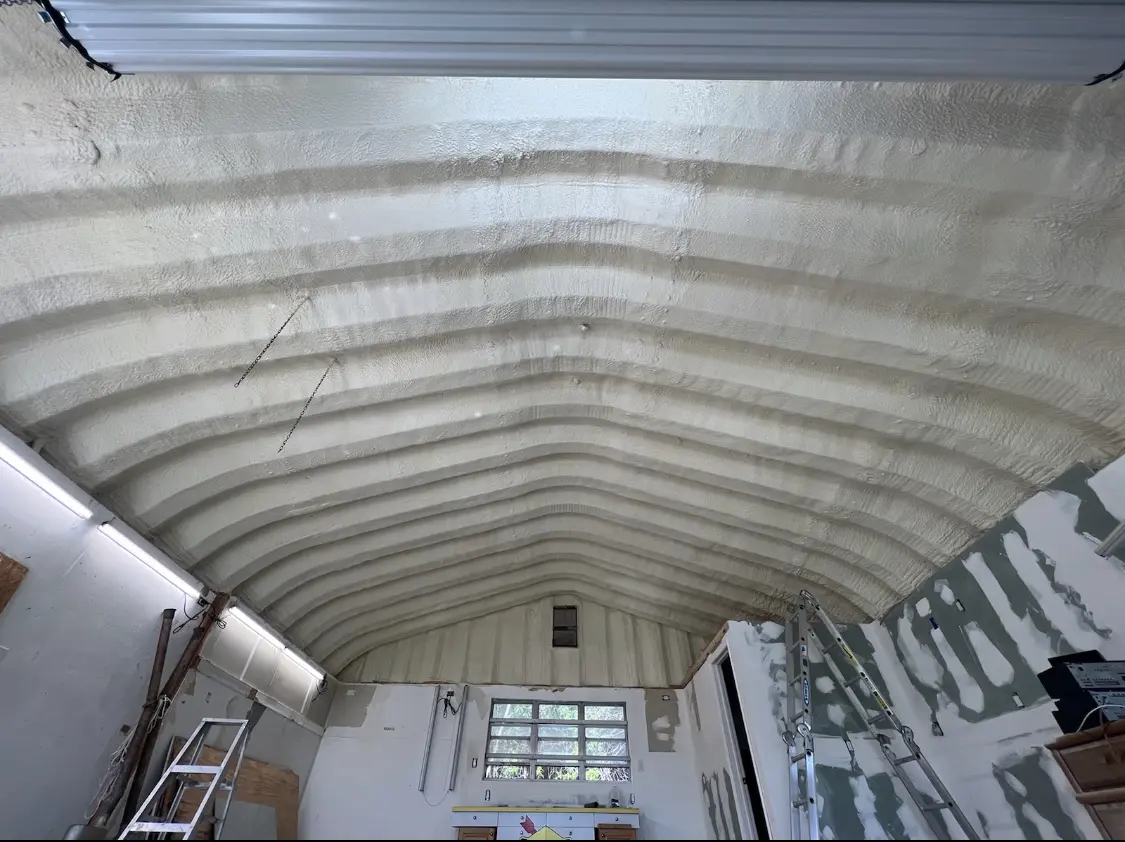 Spray polyurethane foam applied to the underside of a metal roof deck in Warrington